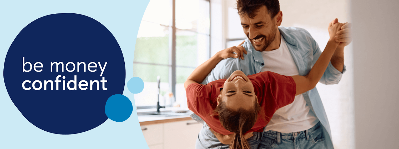 Couple dancing indoors.