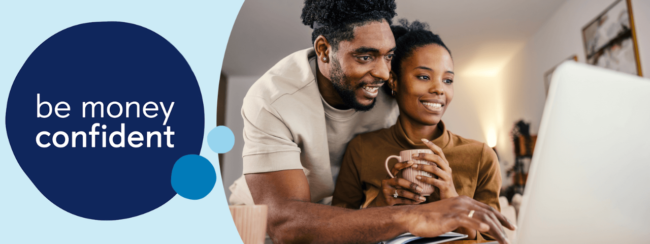 Two people looking laptop screen