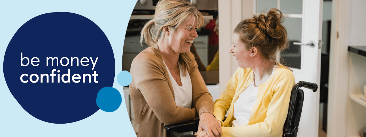 Carer talking to family member in a chair